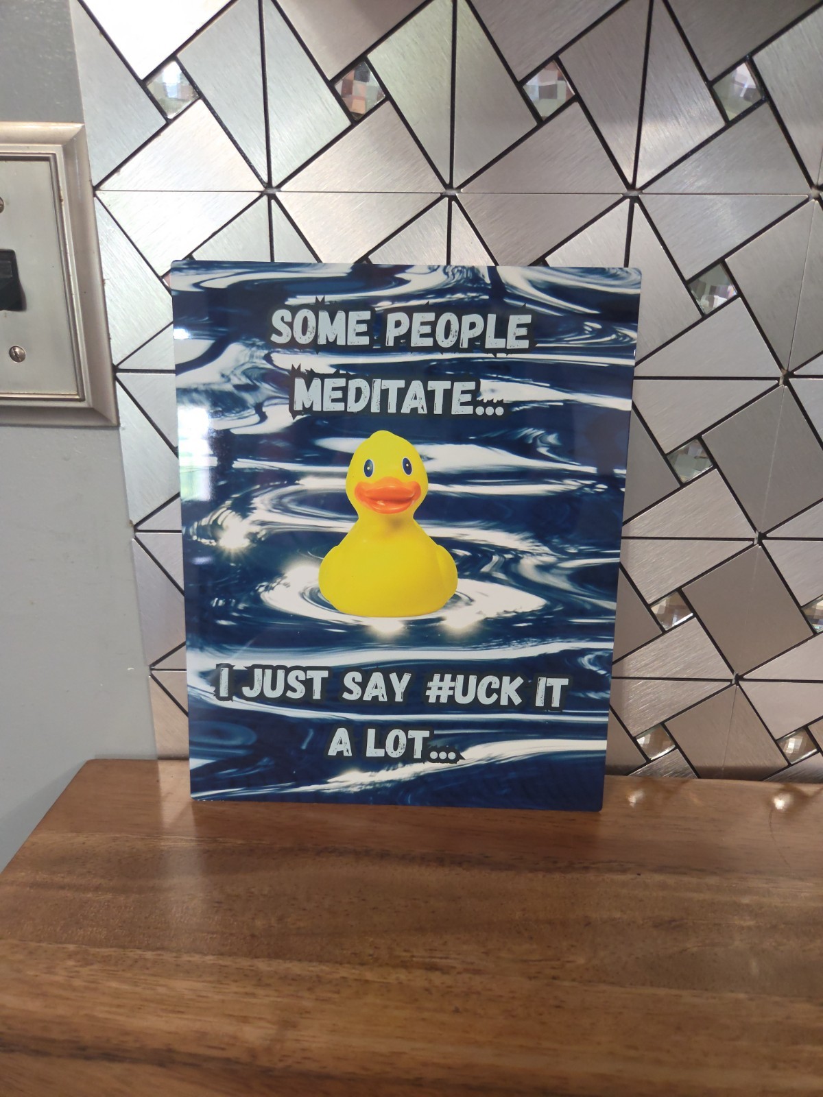 Funny sign about meditation vs saying…Duck it?