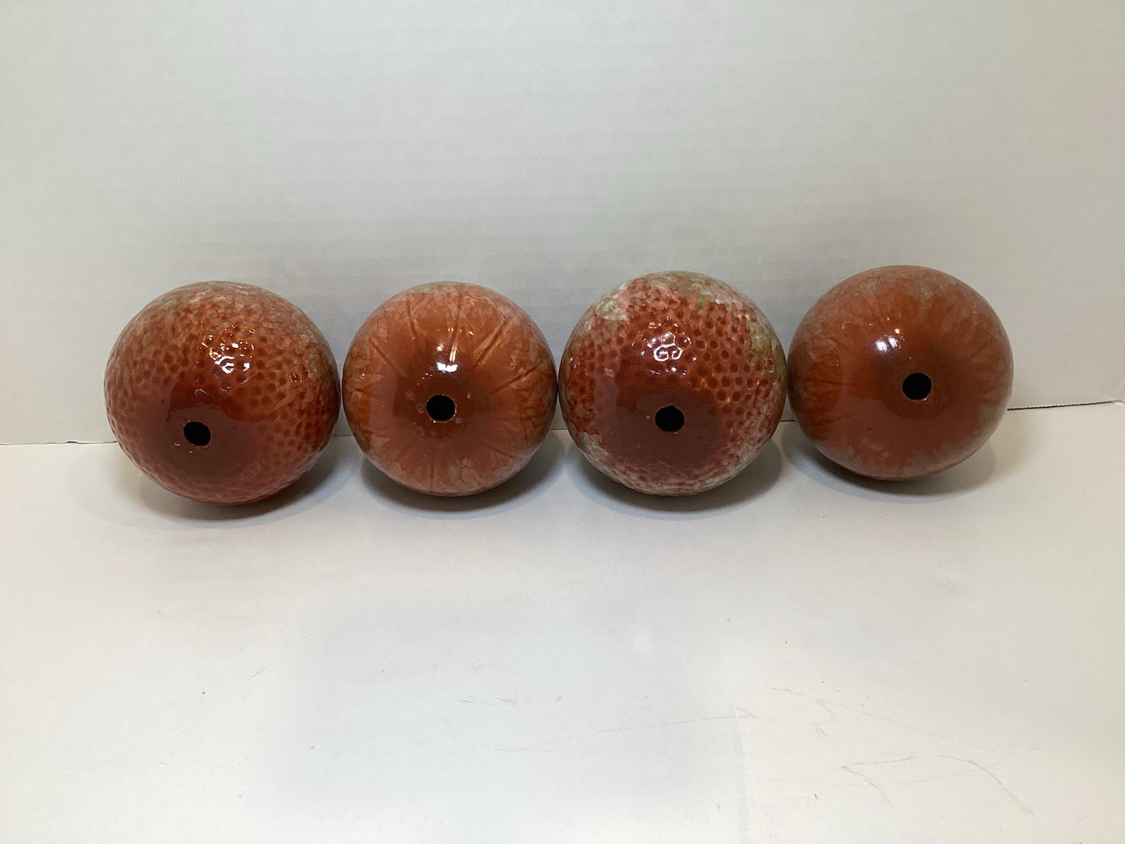 Set of 4 Glazed Ceramic 3.25” Decorative Balls in Rust and Green Colors