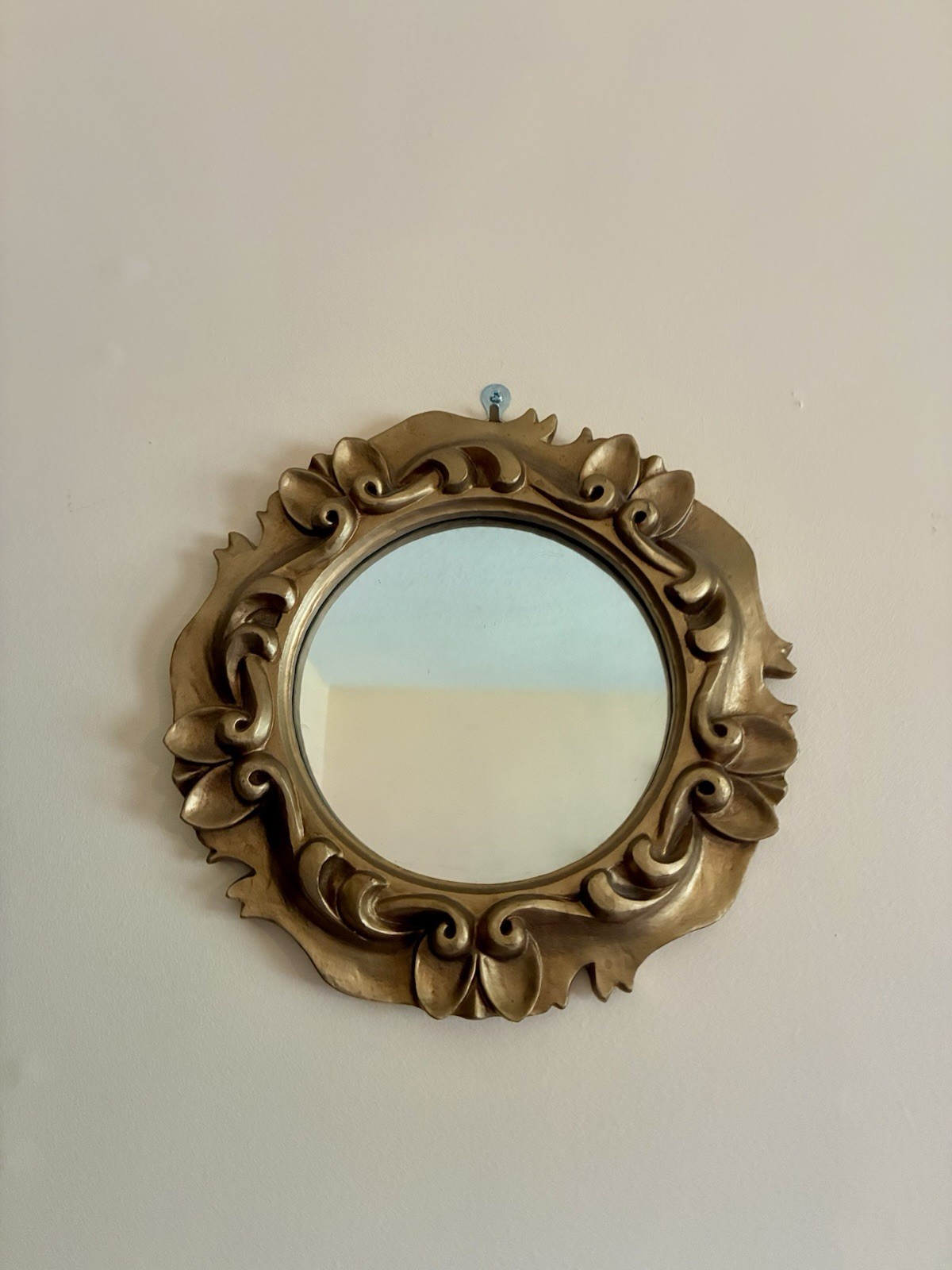 small Ornate accent mirror