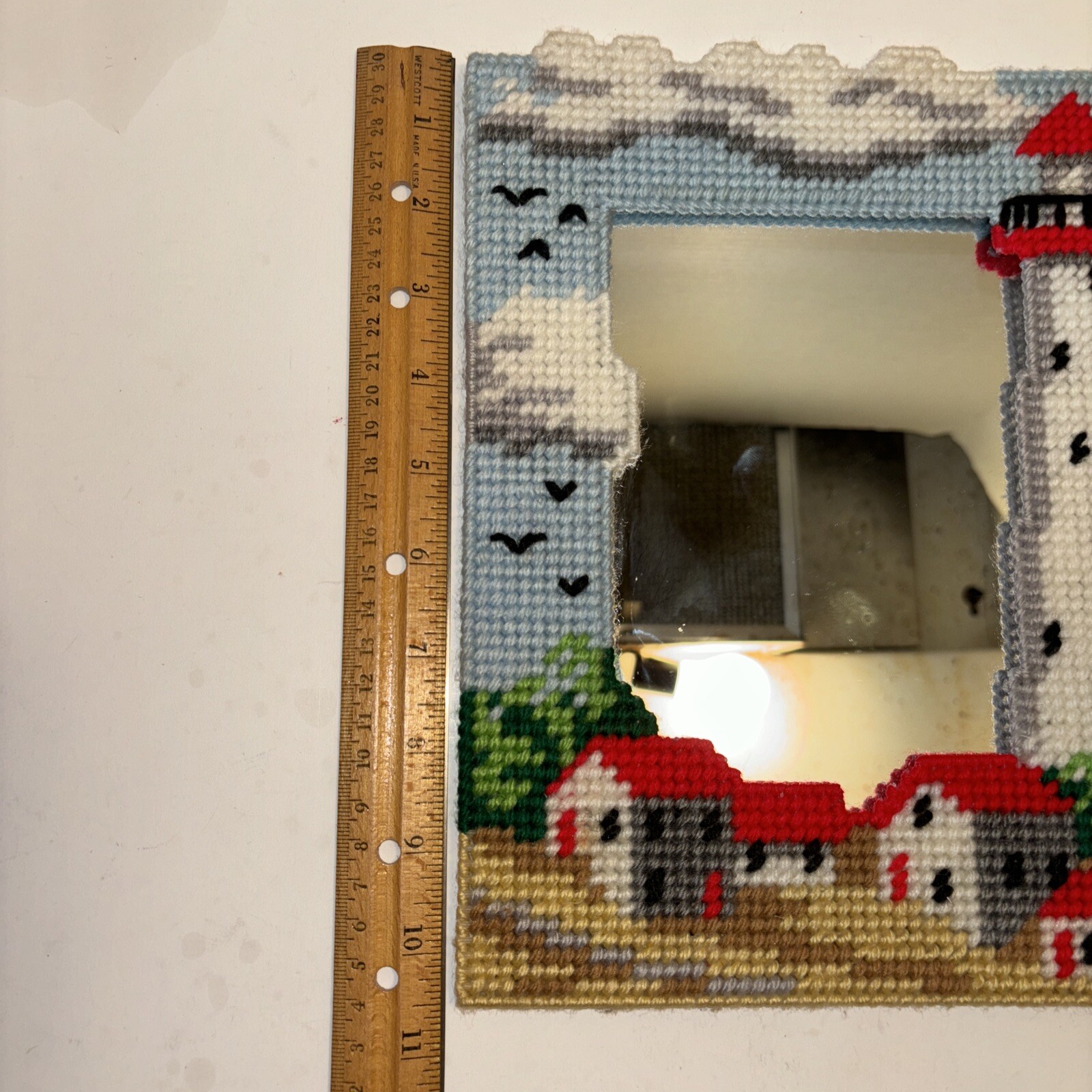 Mirror With A Needlepoint Lighthouse House Design Framing It 10 In X 7.5 In