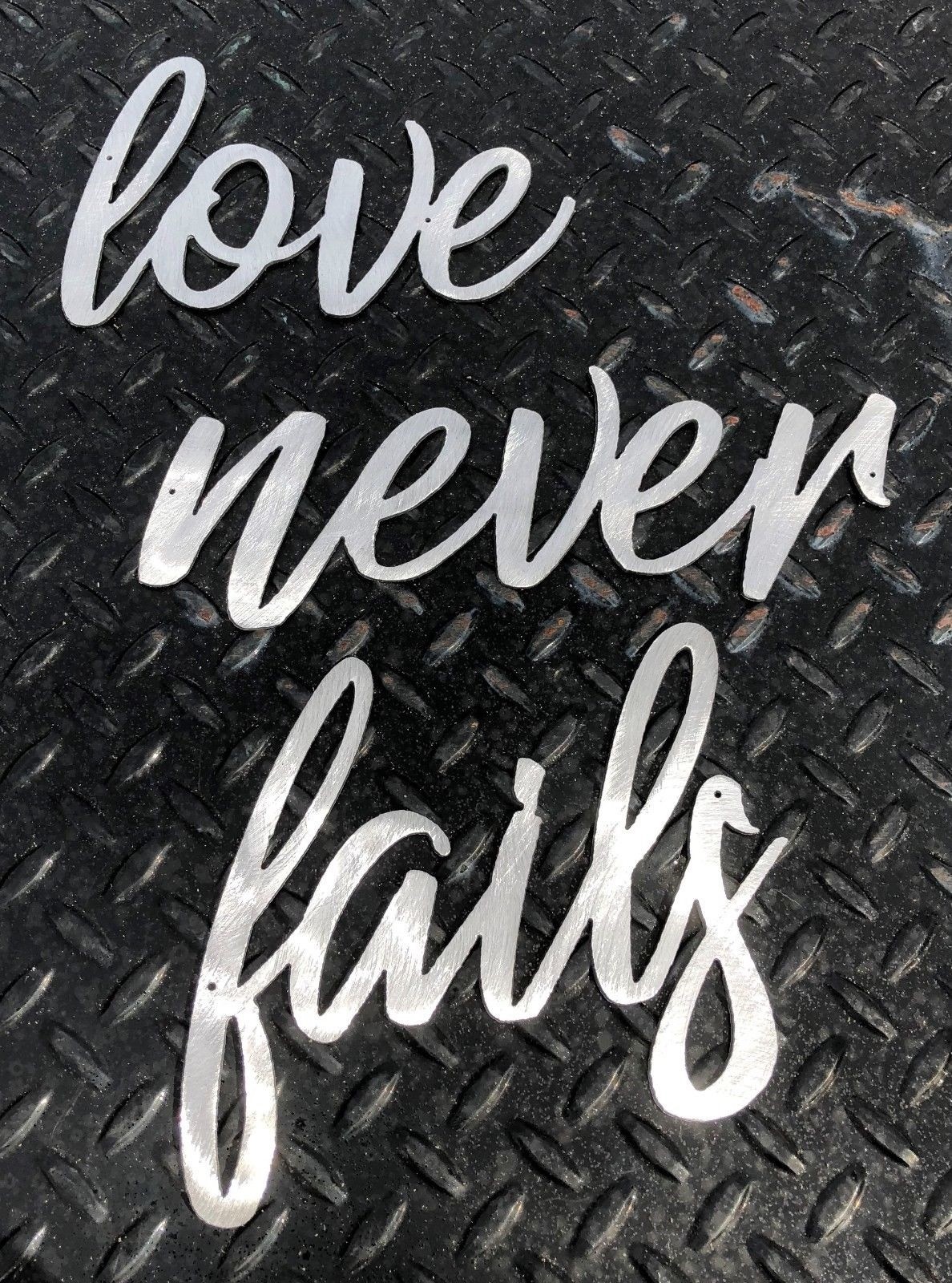 Love Never Fails Words Metal Wall Art Accents Polished Steel – Size Varies