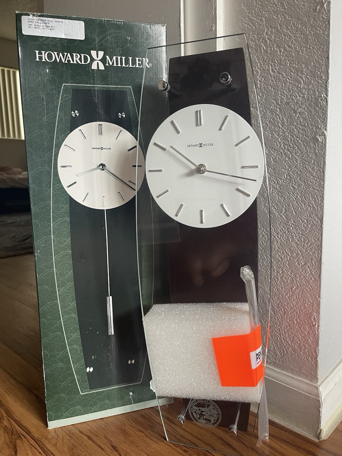 Howard Miller 625401 Wall Clock Pendulum Black White Analog Display