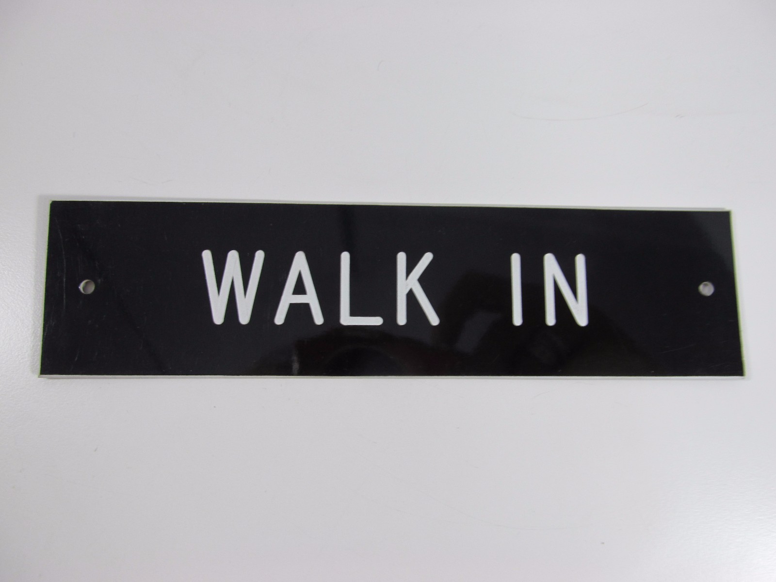 WALK IN SIGN/PLAQUE WALL OR DOOR MOUNTED BLACK PLASTIC 8″ X 2″