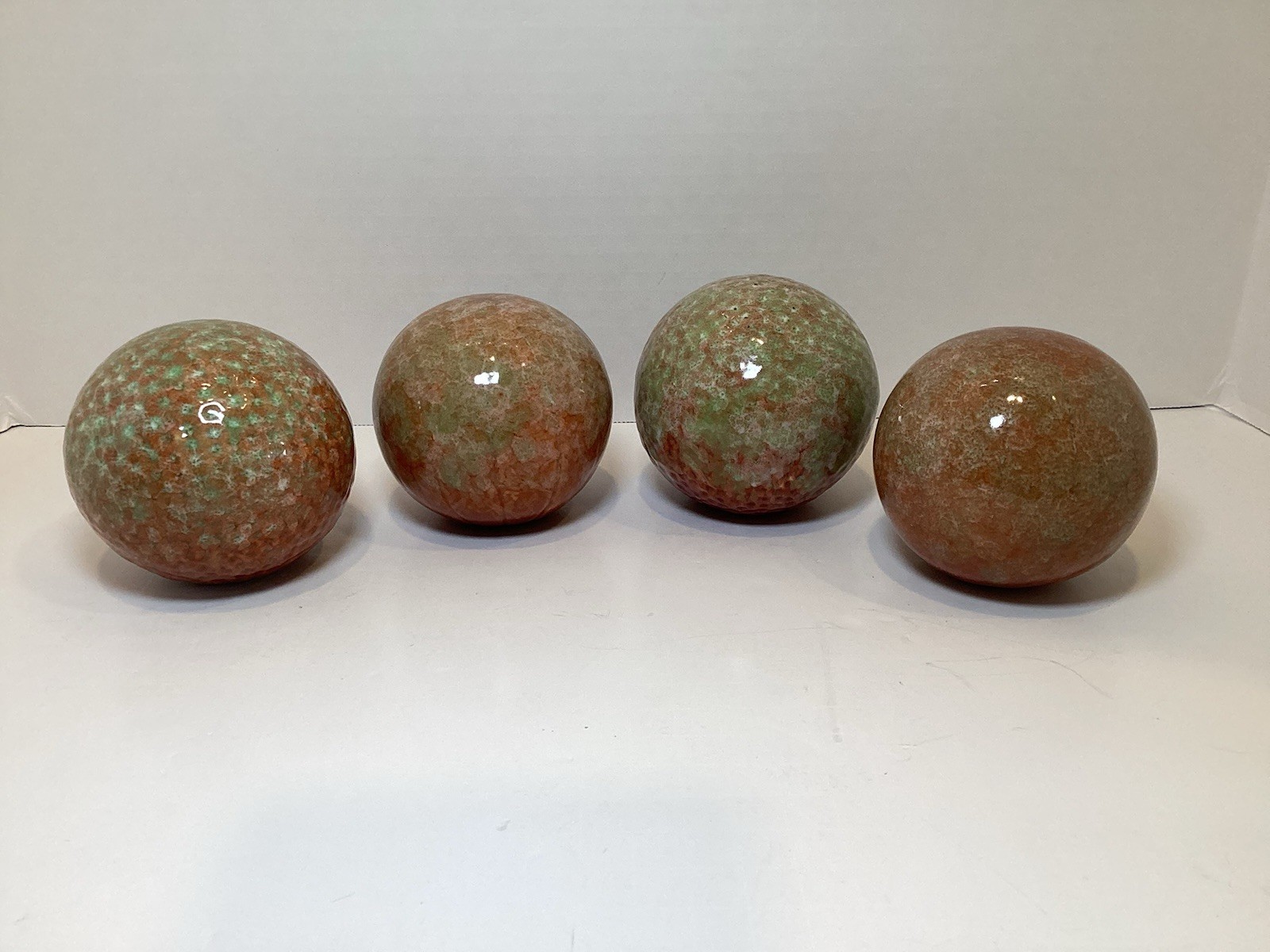 Set of 4 Glazed Ceramic 3.25” Decorative Balls in Rust and Green Colors