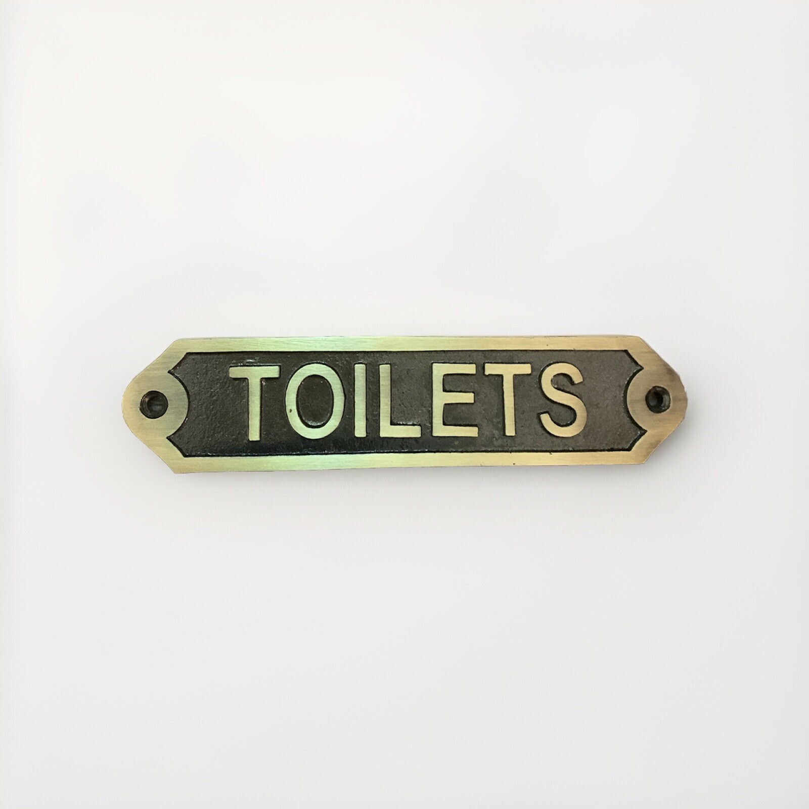 Outdoor decor, small cast iron sign, “Toilets”, antique brass, 6″x1.5″